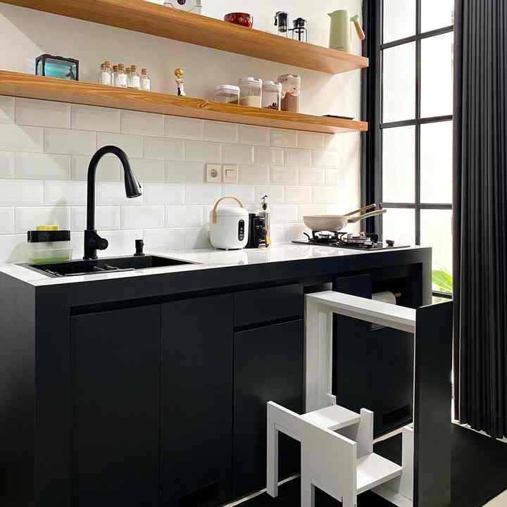 We do not use interior design services. However, we are very considerate in filling the house. Like the kitchen, in the initial plan the kitchen was located at the back of the house, but we moved it into the house to create an open space concept. Additionally, we added a folding ladder inside the lower cabinet. We got this inspiration from Pinterest. After surveying several kitchen set services, we finally found a vendor who could make this folding ladder ✨

#housewithoutarchitect #selfinterior #diy #tanggadapur #tanggalipat #dapursegaris #inspirasidapur #dapurkecil #modena