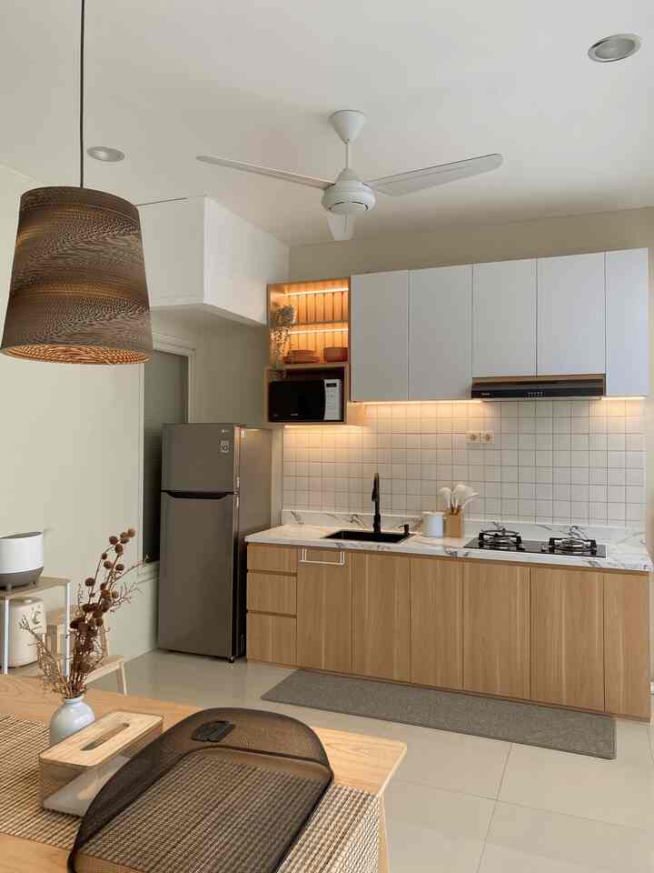 White and wood tone dining room kitchen featuring minimalist Japandi style with clean and warm atmosphere