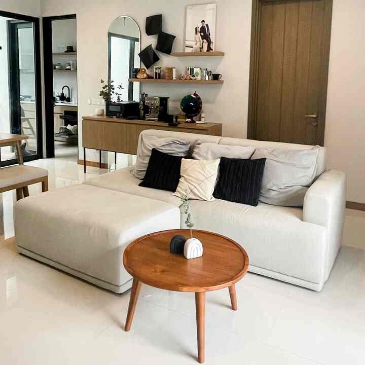 Bright ivory and wood tone living and dining room featuring simple and spacious Japandi style interior