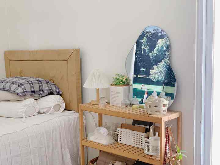 Ruangan yang paling estetik di rumahku yaitu kamar tidur. Kamar tidur ini aku dekorasi dengan konsep minimalis ala korean style yang sangat cocok diterapkan di kamar anak-anak muda. 

Di kamarku ini memiliki 3 area yang aku dekorasi agar terlihat lebih estetik, yaitu area samping tempat tidur, area samping lemari, dan area meja belajar. Kamar tidur ini aku dekor sedemikian rupa untuk menciptakan suasana yang nyaman dan eyecatching saat berada di dalamnya, karena setiap hari aku bisa menghabiskan waktuku di kamar ini untuk belajar maupun istirahat. 

Menurutku yang membuat ruangan ini menjadi lebih estetik karena dekorasi dan perabotnya yang minimalis dan senada sesuai dengan konsep serta suasana yang ingin aku ciptakan. 

Barang dekorasi yang menjadi selling point di ruangan ini yaitu mirror wave berukuran sedang yang aku taruh diatas rak. Karena bentuknya yang unik dan minimalis, cermin ini bisa membuat kamar tidur menjadi lebih terlihat estetik. 

Selain itu, aku juga memberi beberapa artificial flower atau tanaman palsu di kamar agar suasana kamar tidur bisa lebih hijau dan lebih hidup. 

#aestheticroom #aesthetichomedecor #homestyling #kamartidurestetik #aestheticbedroom