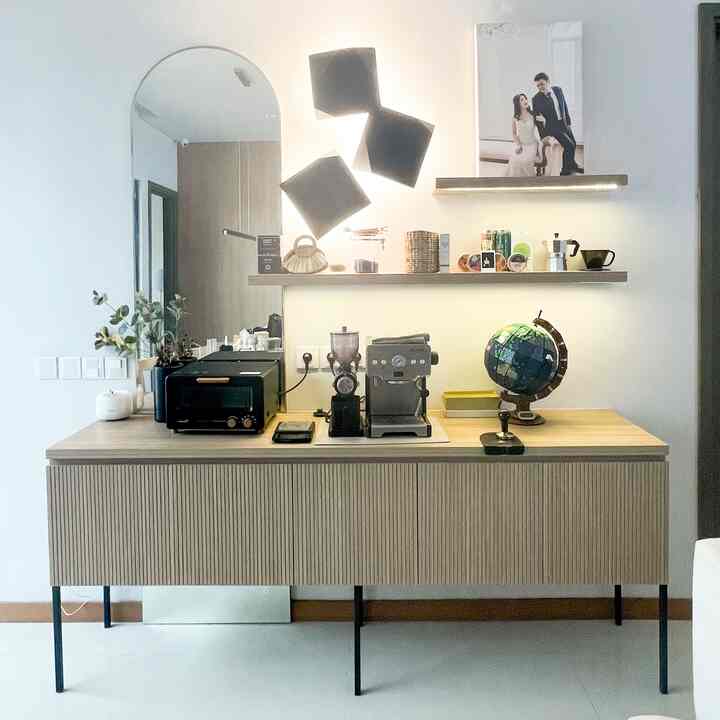 In 2021, a few months after getting married, my husband and I decided to buy a coffee machine and grinder to try making our own coffee. Because we order coffee online almost every day. If you do the math, making your own coffee is much cheaper and the quality and taste are also better! A year later when we finally bought a house and started chatting with our interior designer, we requested that there be a coffee station in your living room. So, we made this custom coffee station whose design was adapted to the theme of our living room. So far very happy with the quality and durability of this furniture. It's just that the drawer is too deep, if it could be remade, maybe I would request more drawers so that the storage could be used more effectively. #japandi #customfurniture #personalizedfurniture #uniquefurniture #BSD #rumahcluster #coffee #coffeelovers