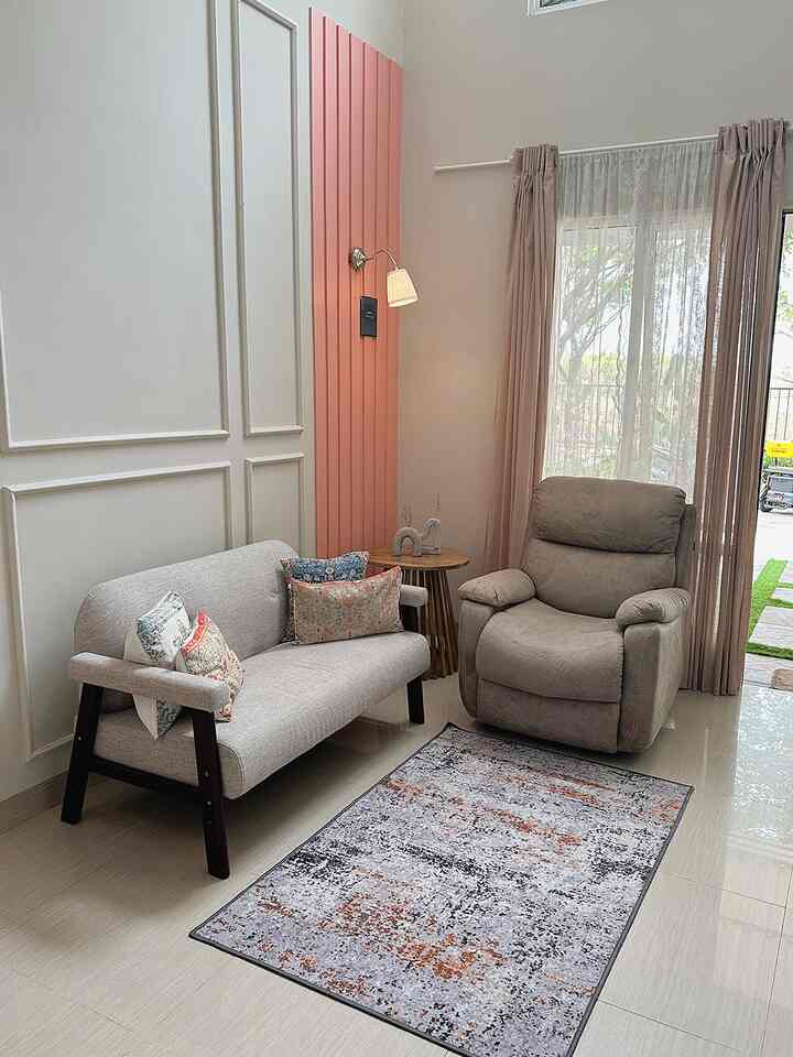 Natural and Scandinavian toned 4x3m living room featuring a two-seater sofa, recliner, and rug in a cozy and spacious setup