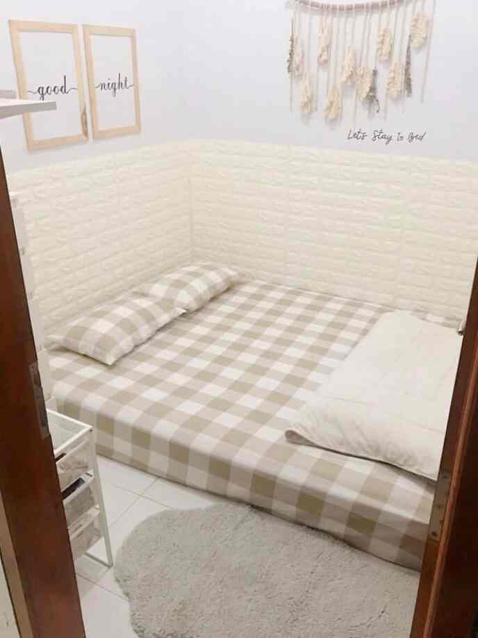 Beige and white toned 6-tatami bedroom featuring a bed with pillows and blanket, creating a cozy and clean space
