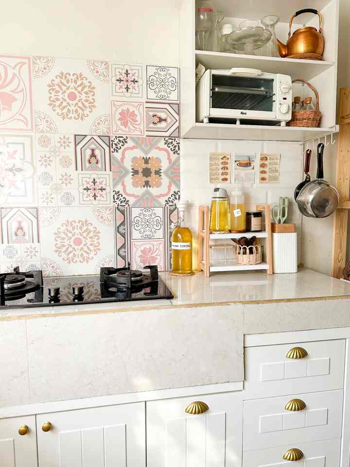 Natural color and white toned kitchen featuring patterned tile wall, organized storage shelves, giving a clean and cozy atmosphere