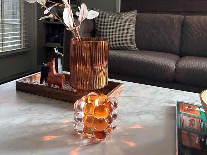 #decor #decoration #candleholder #coffeetable This pillar candle holder is a new favorite of mine. It surprises me that I cannot find a link for this item. Google Images couldnt find it. I even looked on Hobby Lobby‘s website. I would call it a bubble glass candle holder. I love the reflections that it throws on the table when it is lit. ￼