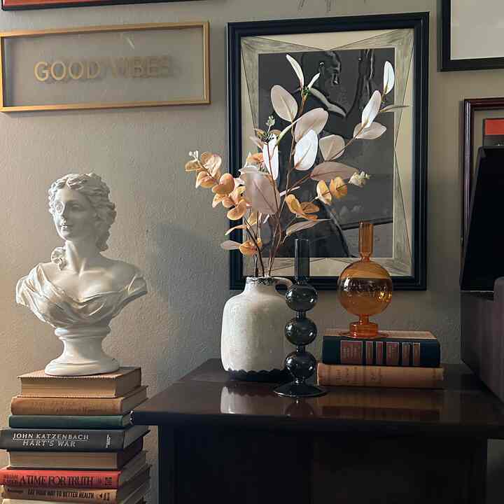 #interiorobject  #bust #plants #florals #wallart #midcenturymodern #vignette I love the decorating that I did today. ￼This shows one of the vignettes that I did. ￼Here are my new Nordic Artistic Crystal Glass Candle Holders. I might put candles in them occasionally.￼ I also switched out the florals in the vase.￼ 