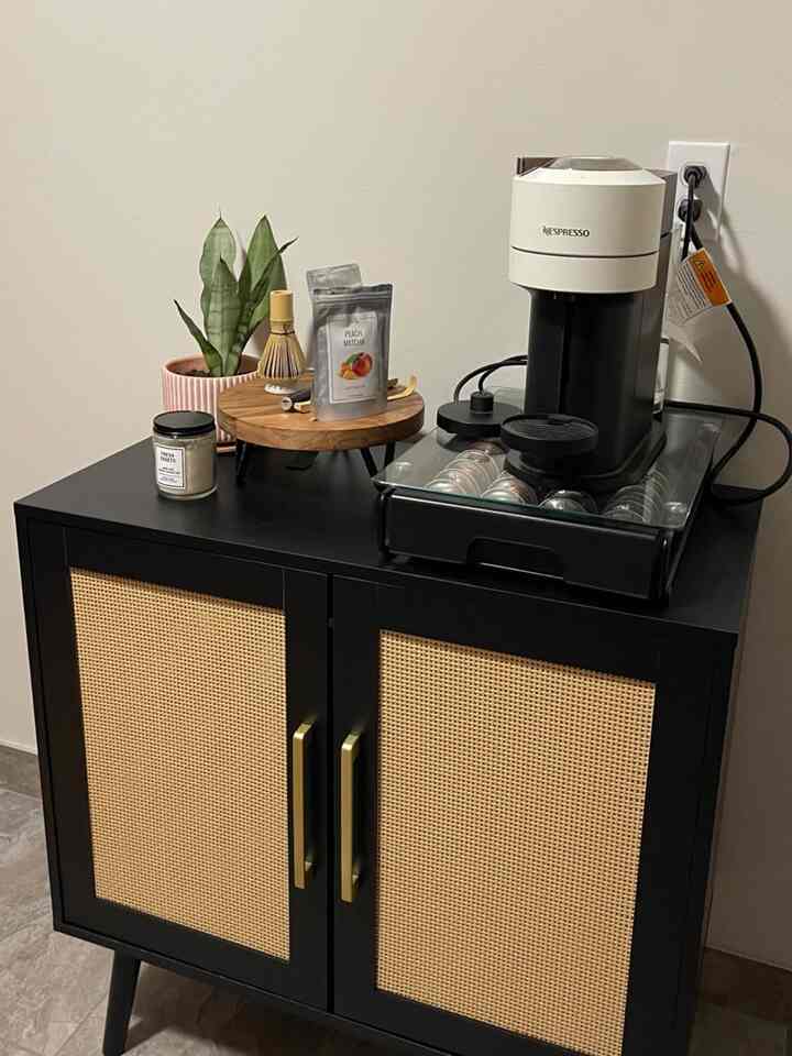 Natural color and black kitchen sideboard featuring Nespresso capsule coffee machine and matcha utensils in a home cafe setup