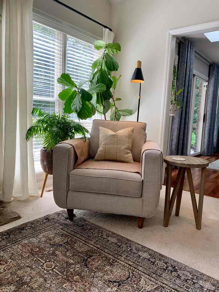 Redecorating our living room to a #warmtoneinterior from greys and blues. I love browns, greens, rust, and a peachy pink together. I chose black and brass as accents. Our living room gets beautiful light which compliments these #warm colors well and makes for a #cozy  living space. 