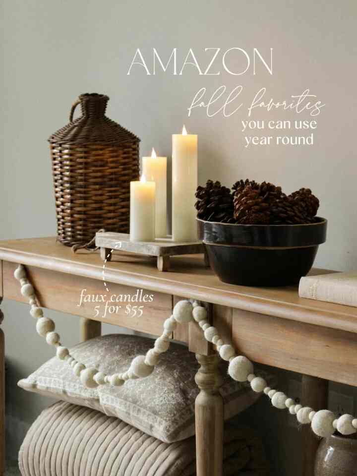 Warm brown-toned living room console table featuring candles, pinecones, and a wicker basket with a natural style