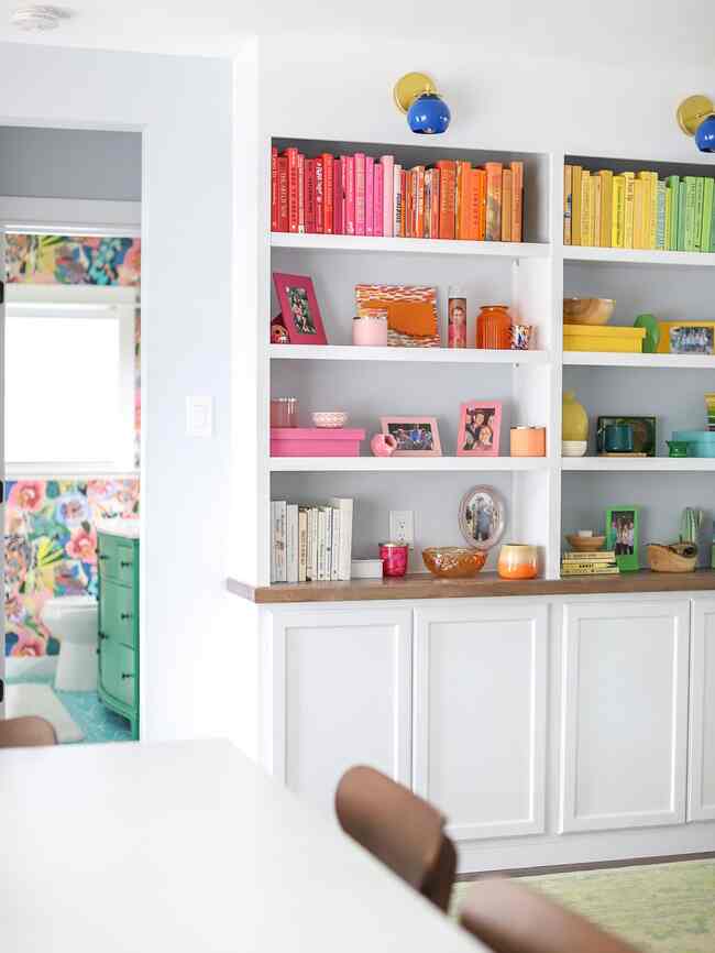 Easy ways to add color to your home: books, candles, vases, holiday decor, and paint! I painted unfinished boxes and it was a great place to store pictures and cards plus it adds a pop of color! #colorfulinterior #homedecor #diydecor