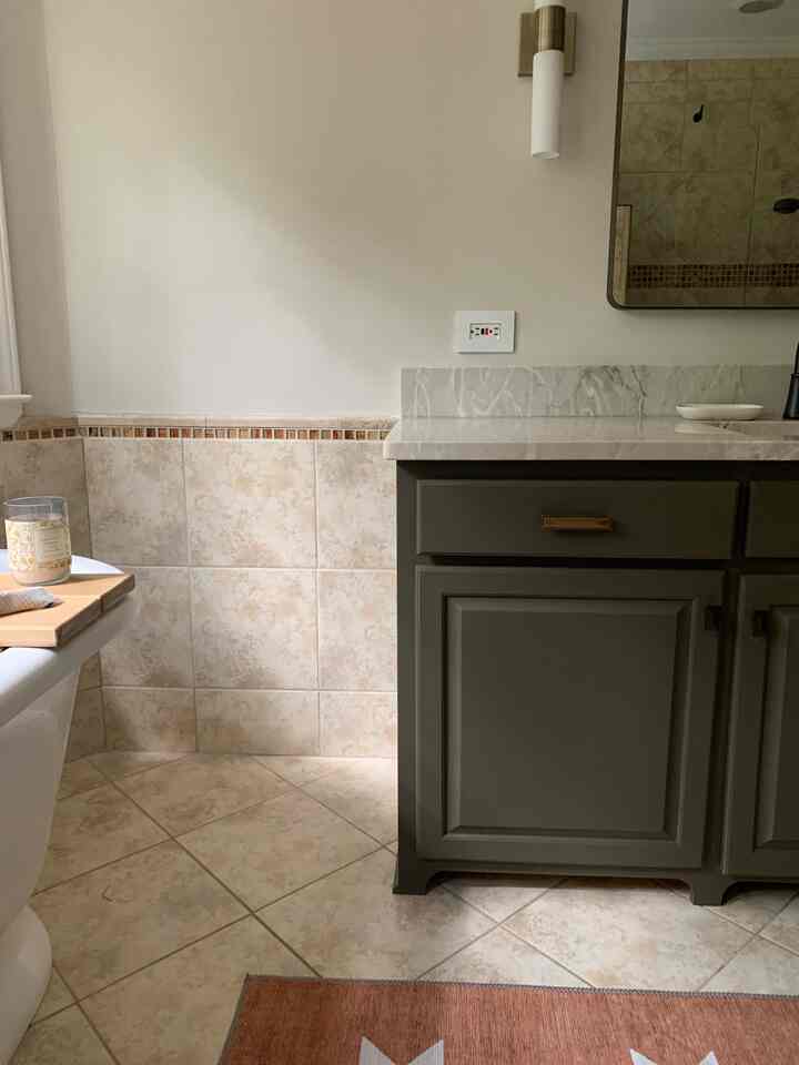Our bathroom vanity area needed an update. The salmon pink granite countertops, crystal sconces, and broken faucet needed to go. The difficult part was coordinating with the porcelain #travertine like tile. It is everywhere in our bathroom not to mention the orange mosaic glass tiles. In the end, I think it all came together looking modernized without having to do a full bathroom gut job. 