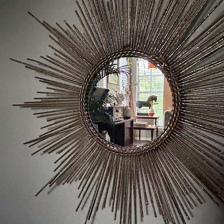 Reflection of my favorite corner in my sunburst mirror…￼ #sunburstmirror #midcentury #vintagedecor #mirror #favoritespaceinourhouse 
