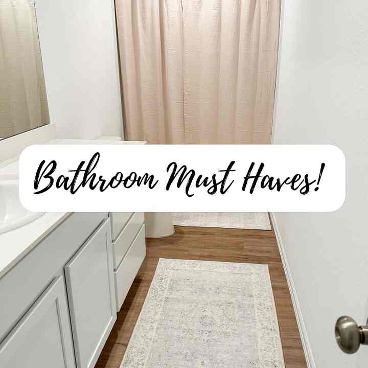 White and brown toned bathroom featuring bath mats and curtains with a clean, classic atmosphere