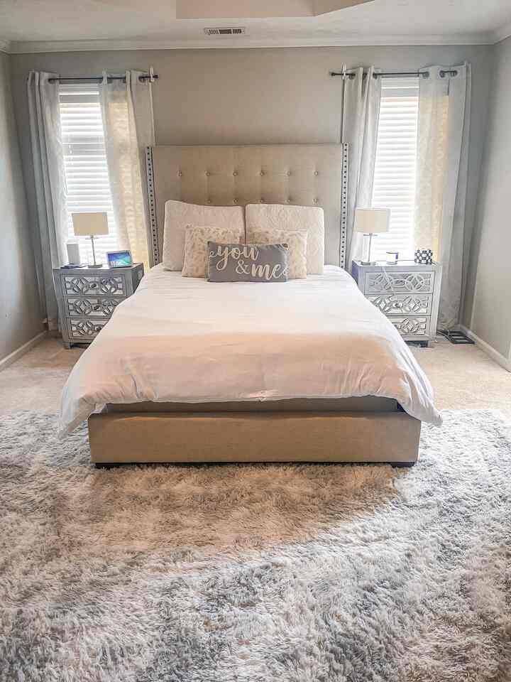 In this bedroom, tranquility meets comfort with its gray, white, and beige color scheme. The walls are a soft shade of gray, setting a serene backdrop. Crisp white bedding adorns the bed, exuding an air of simplicity and cleanliness. 

Underfoot, a plush gray rug provides a luxurious touch and adds to the overall comfort of the room. It's the perfect spot to sink your feet into after a long day. This combination of colors and textures creates an inviting oasis for rest and relaxation.

#bedroominterior #bedroomdecor #grayinterior #cozybedroom 