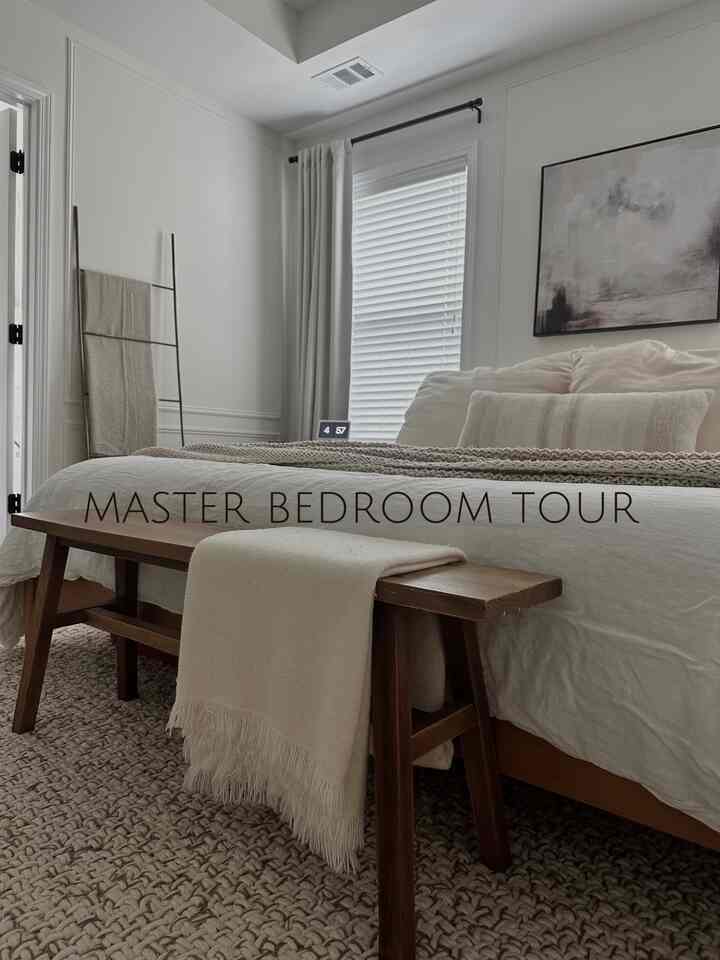 I wanted out master bedroom to be a calming, relaxing space so I try to keep it neutral adding in warmth with natural wood grain and greenery 🍃 
#masterbedroom #neutralaesthetic #pictureframemolding 