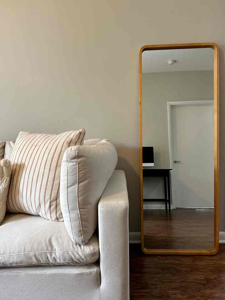 A full length mirror is a necessity in a small living room ✨ 
#livingroom #livingroominterior #livingroomsofa #mirror 