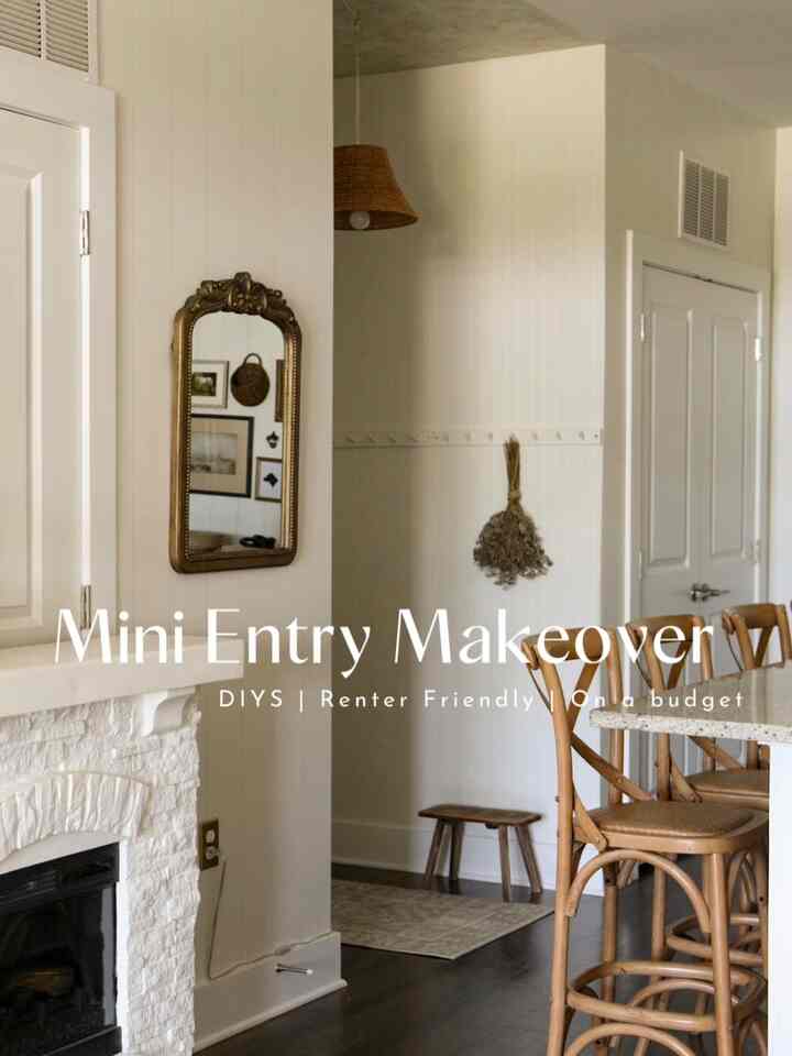 Bright white entrance featuring mirror, natural brown wooden stools, and a rug creating a cozy rustic modern vintage atmosphere