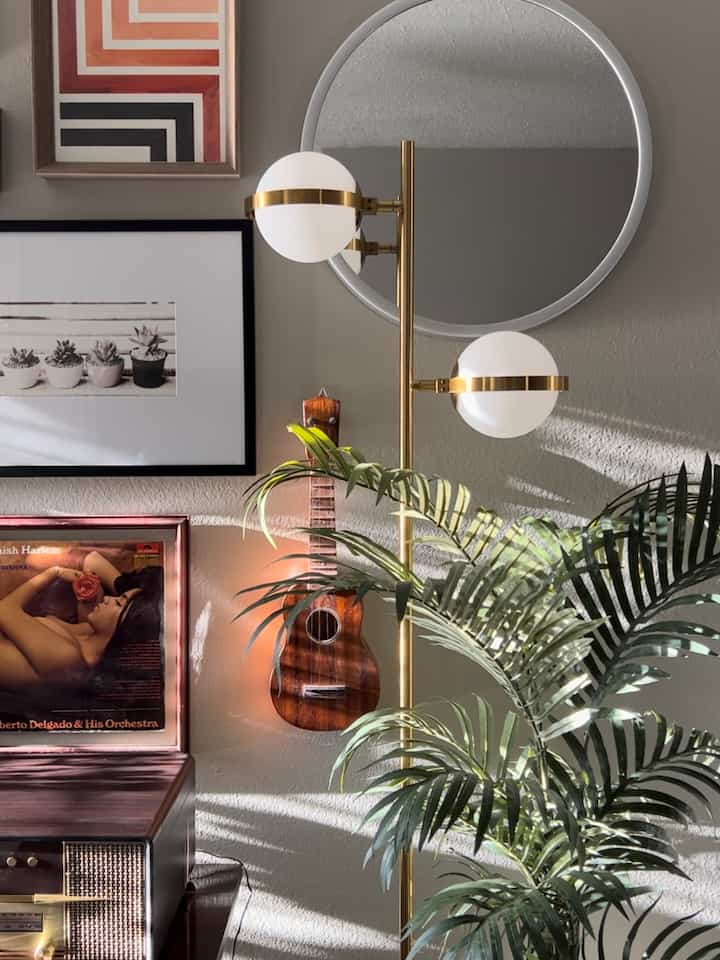 #lamps #floorlamps #palmplants #lightinginterior #artwall I consider this floor lamp that I have to be somewhat unique. Why? Because I see plenty of lamps that utilize the orbs or globes in various configurations but I never see them having a band wrapped around the orbs (globes). I never see any home interior pics shared online showing this same lamp. The Amazon seller that I bought it from (Beaysyty) is the only seller that I’ve seen offer this. I consider the style of it to be a blend of Art Deco and Mid-Century Modern. I’m glad that I chose this lamp because it has that “something extra” that helps show a bit more uniqueness in my space. And to add to that…Amazon shows it currently unavailable. I hope that it becomes available again by the time that you visit the link. (If you want one) 