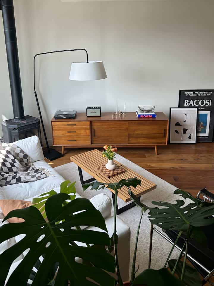 Natural-toned living room featuring mid-century modern furniture and cozy atmosphere