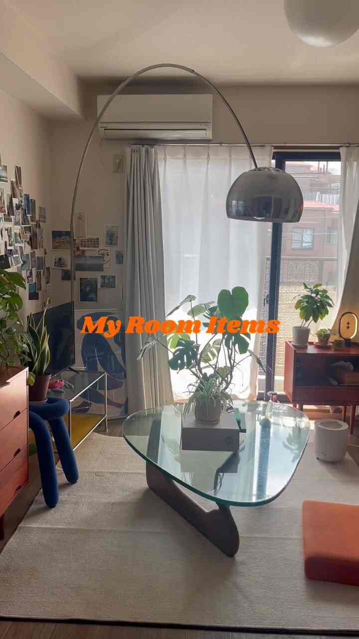 Beige-toned 8-tatami living room featuring mid-century modern coffee table and plants in a cozy setting