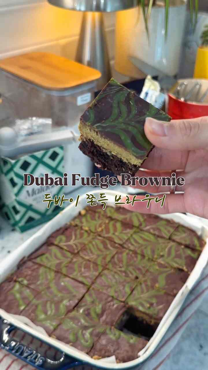 Cozy home cafe kitchen with dominant brown and natural wood tones featuring Dubai Fudge Brownie in ovenware