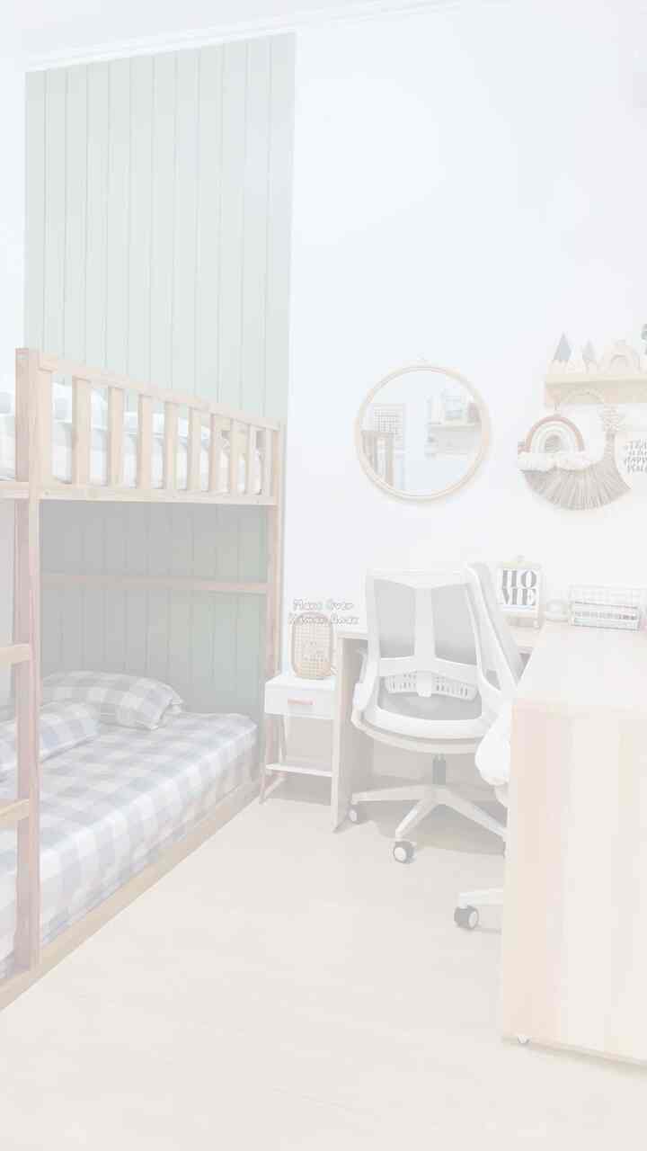 Bright kids' room with white walls and wood-toned furniture, featuring wooden bunk beds and a children's desk for a cozy study environment