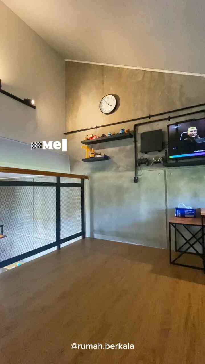 Natural color and gray toned loft space featuring folding desk and gaming chair for a modern, space-saving interior