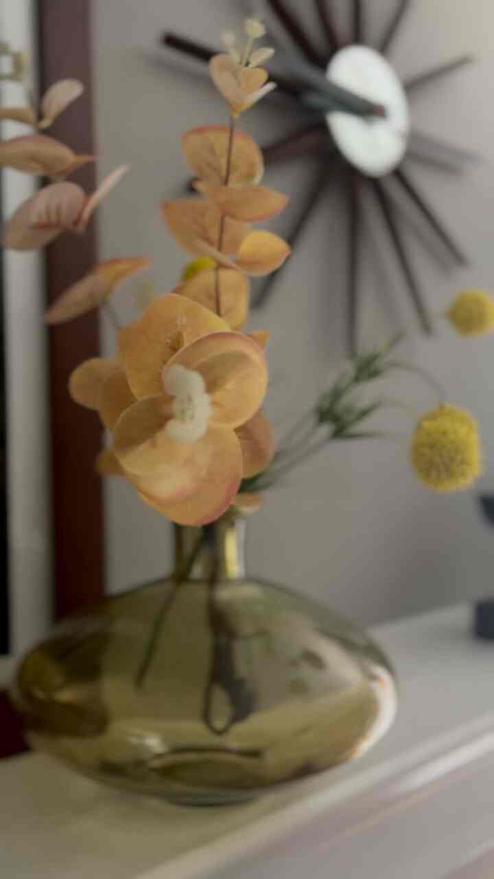 #vignette #vase #midcenturymodern #florals I love this vase and the florals I put in it.￼ I also love the clock and the framed art print. I am excited to see how I will style these same objects in my new apartment. ￼