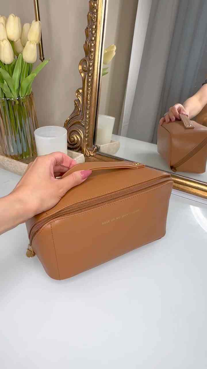 Packing my makeup bag for a trip at my vanity.   #traditionalhomedecor #makeupvanity #makeupbag #vanitymirror 