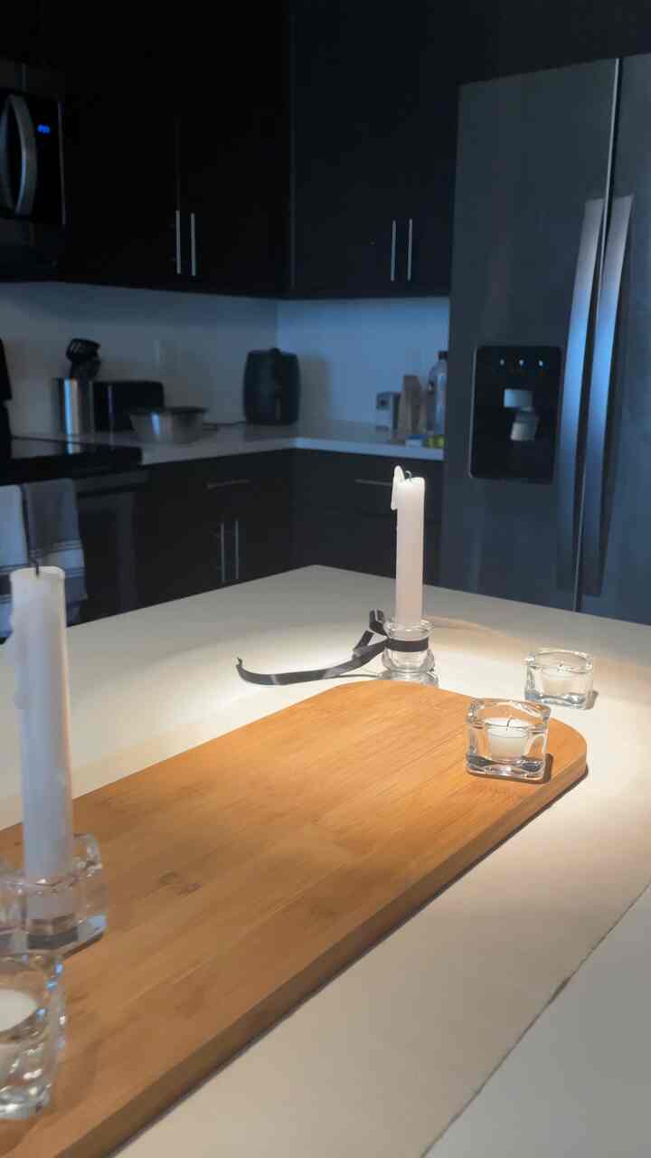 Setting up for a candle lit dinner on my kitchen counter #candles #dinnersetup #hosting