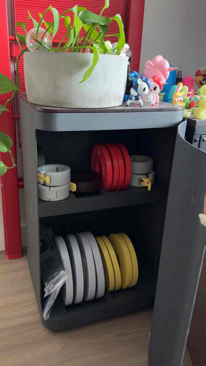 Love this hidden storage for my colorful weights! It adds some hidden spring colors into my space #springcolors #weights #smallstorage
