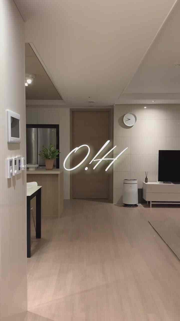 Beige and wood tone living room combined with kitchen, showcasing a calm and modern ambiance