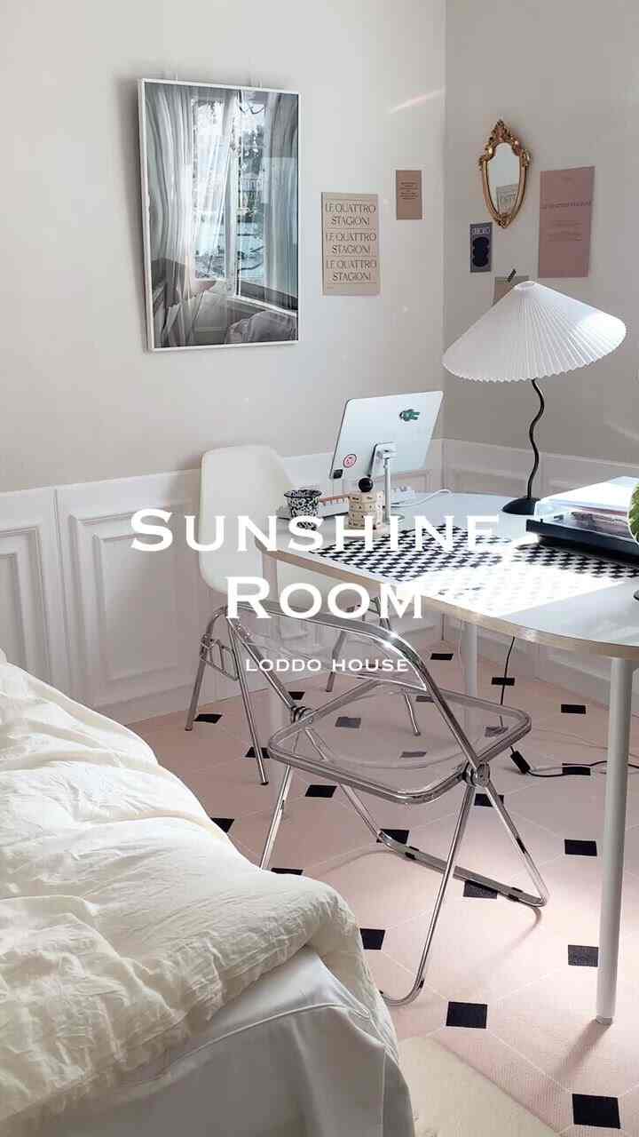 Bright white-toned single household home office with transparent chair, featuring simple and clean interior design